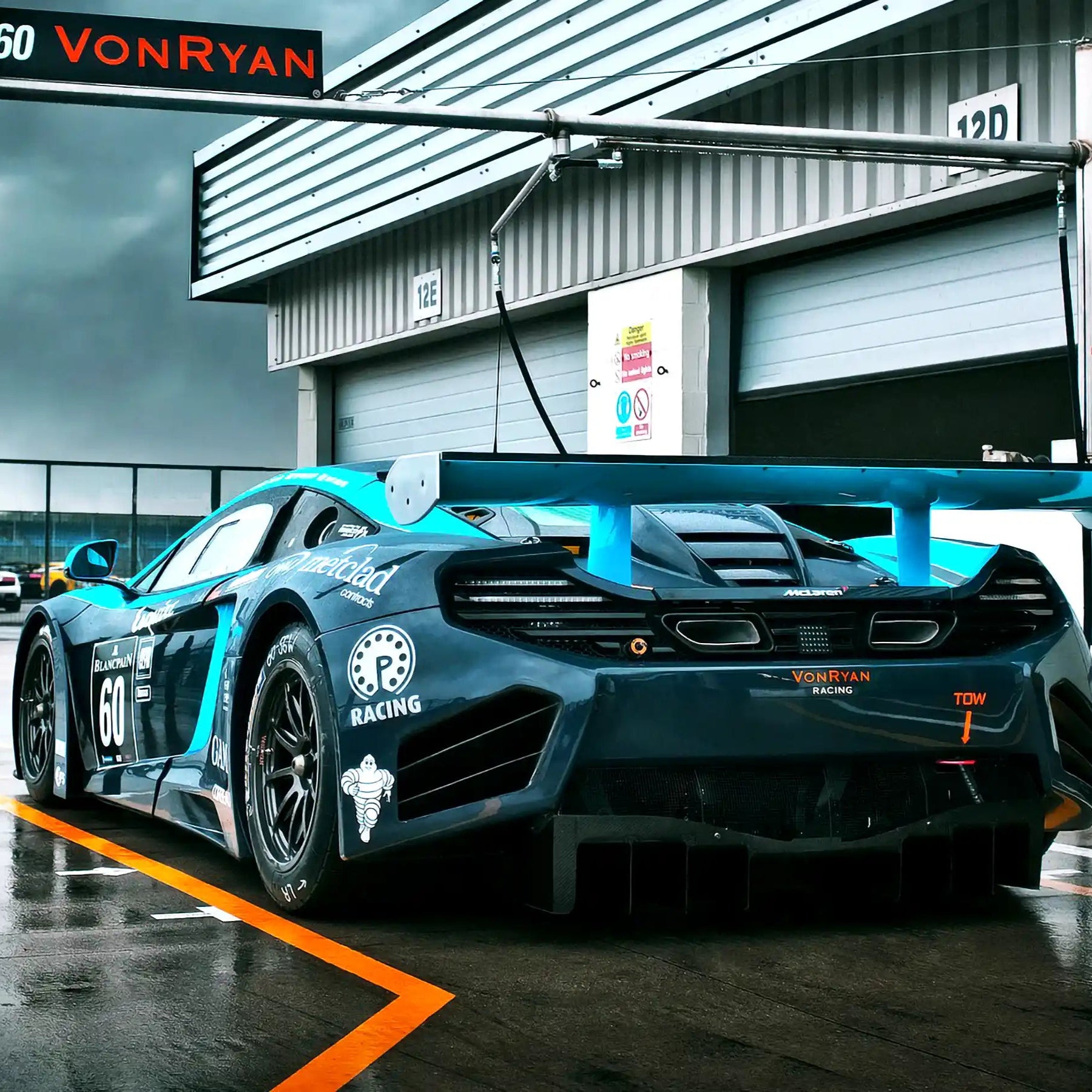 Rear View of Von-Ryan Race Car Partnered with STEELE, Promoting GEN4 Brake Cooling Blower Technology in Pit Lane